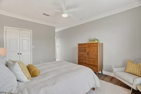 a bedroom with a bed and dresser
