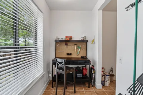 a view of a workspace with furniture