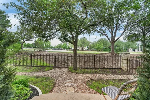 a view of a bench and a small yard