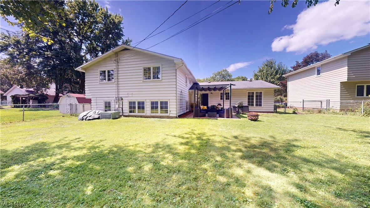 1071 Roland Road Lyndhurst, OH 44124 - Photo 26 of 30 Back of property with a yard and a patio