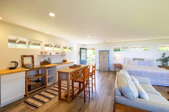 a bedroom with a bed and a night stand