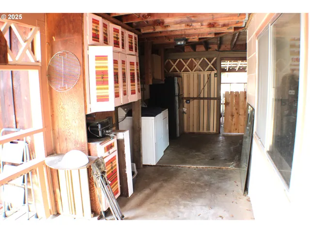 a kitchen with stainless steel appliances kitchen island granite countertop a stove a sink and a microwave