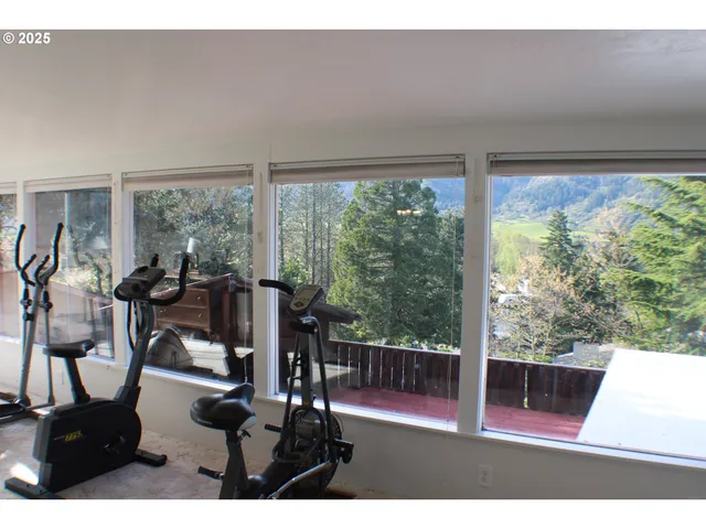a view of a living room and floor to ceiling window