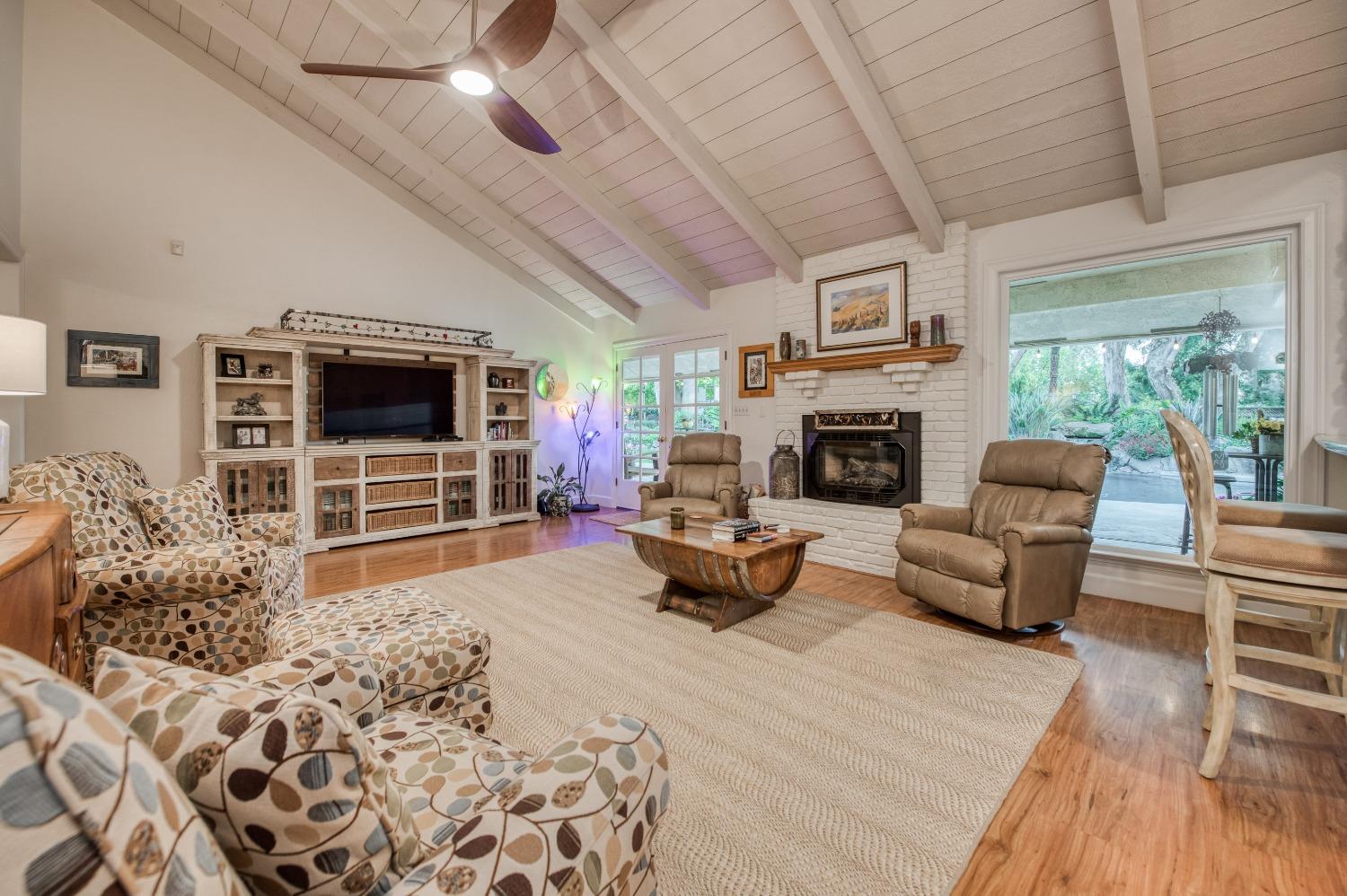 2988 Enterprise Avenue Clovis, CA 93619 - Photo 14 of 99 a living room with furniture fireplace and flat screen tv