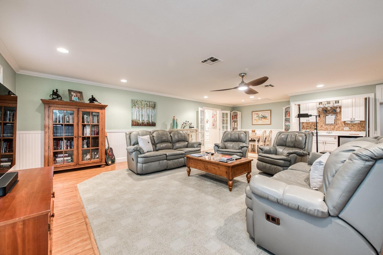 2988 Enterprise Avenue Clovis, CA 93619 - Photo 17 of 99 a living room with furniture and a book shelf