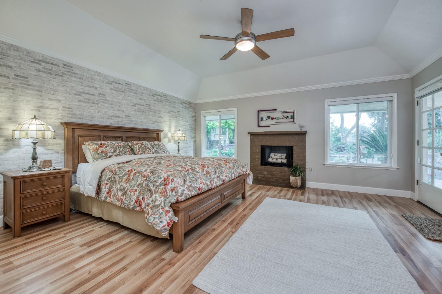 2988 Enterprise Avenue Clovis, CA 93619 - Photo 18 of 99 a bedroom with a bed and a fireplace