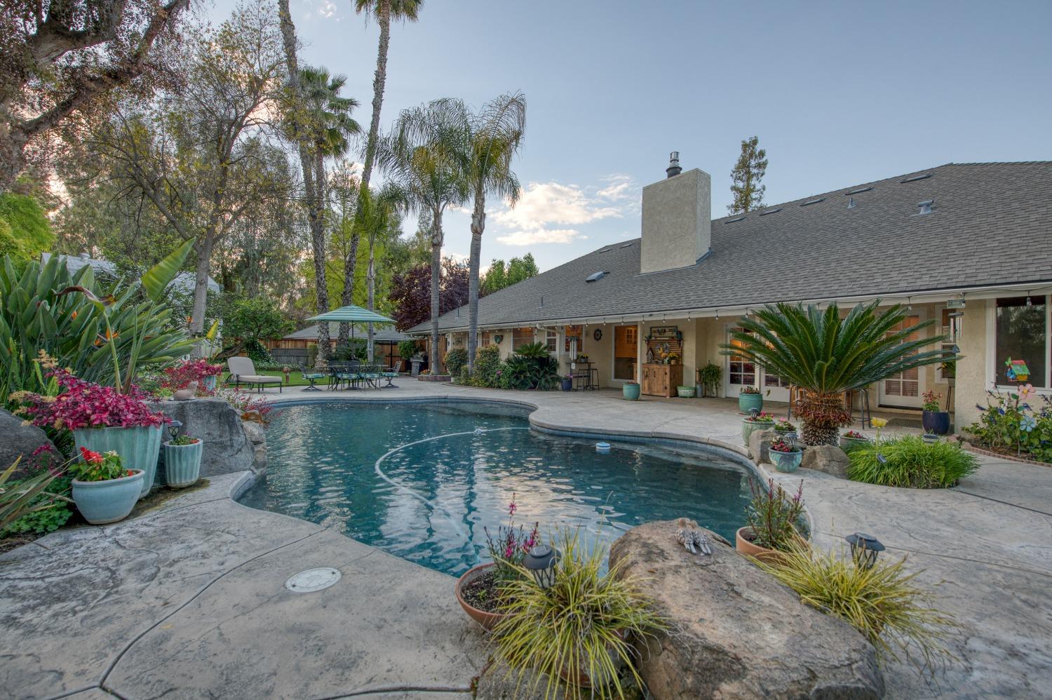 2988 Enterprise Avenue Clovis, CA 93619 - Photo 44 of 99 a house with swimming pool in front of it