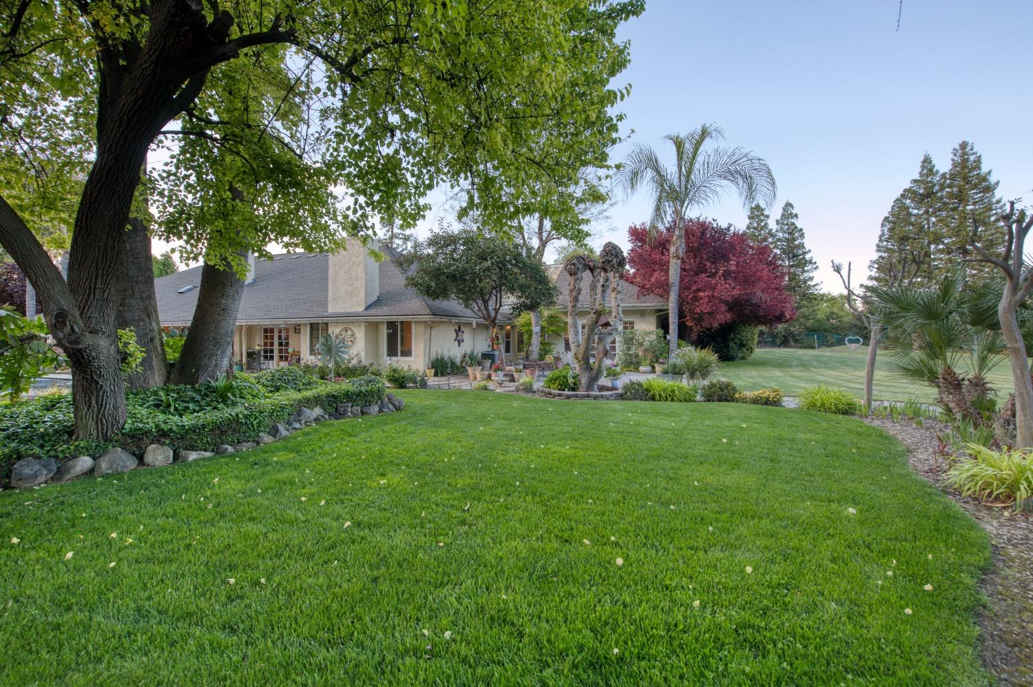 2988 Enterprise Avenue Clovis, CA 93619 - Photo 53 of 99 a front view of a house with garden