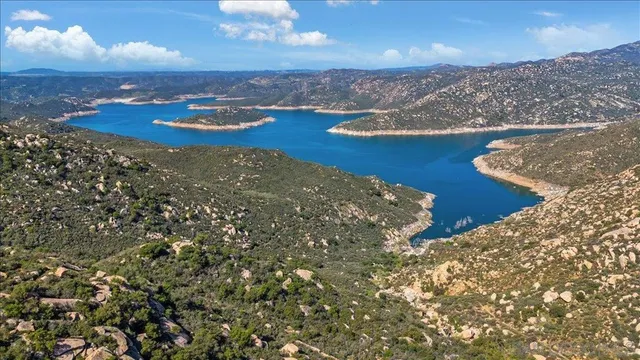 a view of a lush green hillside and a building