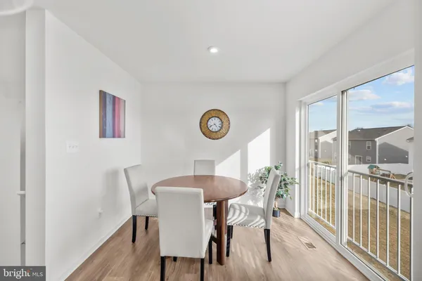a view of a dining room with furniture window and outside view