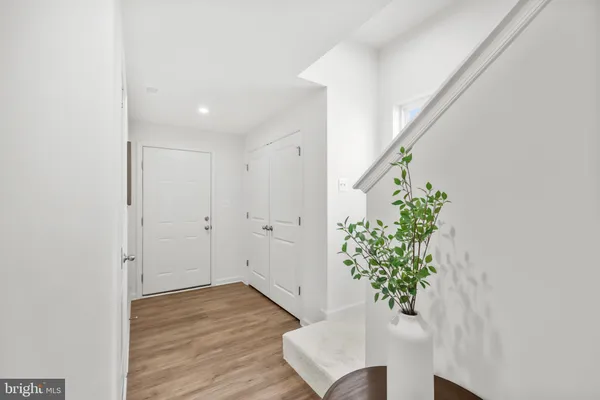 a view of entryway with wooden floor