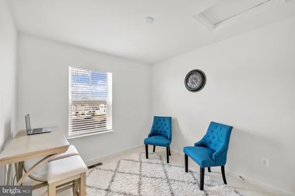 a view of a livingroom with furniture and a chair