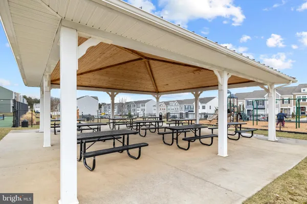 a view of a chairs and table in patio