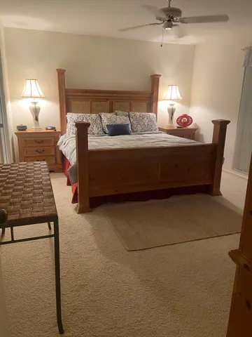 a bedroom with furniture and a lamp