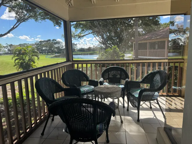a view of a chairs and table in patio