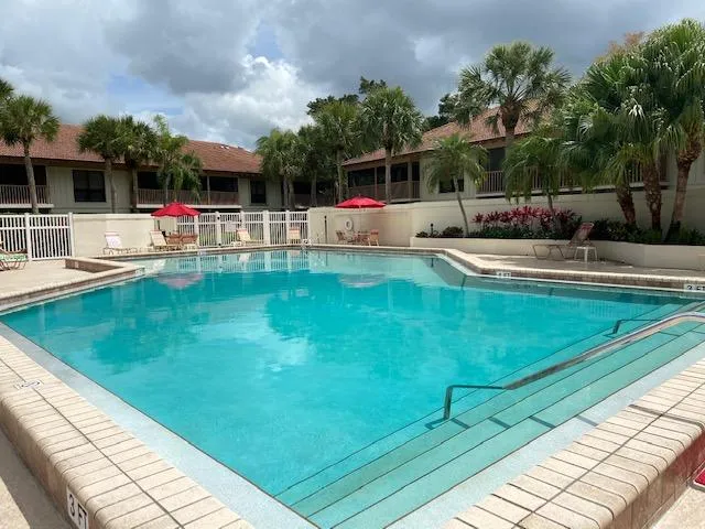 a view of a swimming pool with a patio