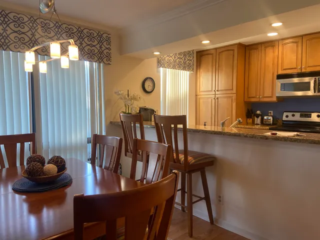 a view of a dining room with furniture and window