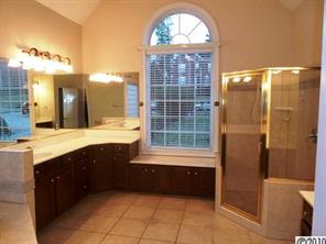 908 Ashford Way Fort Mill, SC 29708 - Photo 11 of 16 a bathroom with a double vanity sink a toilet and a bathtub