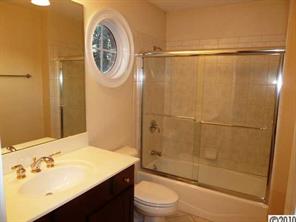 908 Ashford Way Fort Mill, SC 29708 - Photo 13 of 16 a bathroom with a granite countertop sink toilet and shower