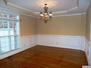 908 Ashford Way Fort Mill, SC 29708 - Photo 4 of 16 a view of wooden floor and chandelier in a room