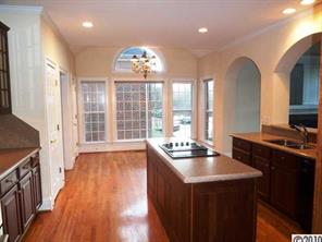 908 Ashford Way Fort Mill, SC 29708 - Photo 7 of 16 a dining hall with stainless steel appliances granite countertop a stove and a wooden floors