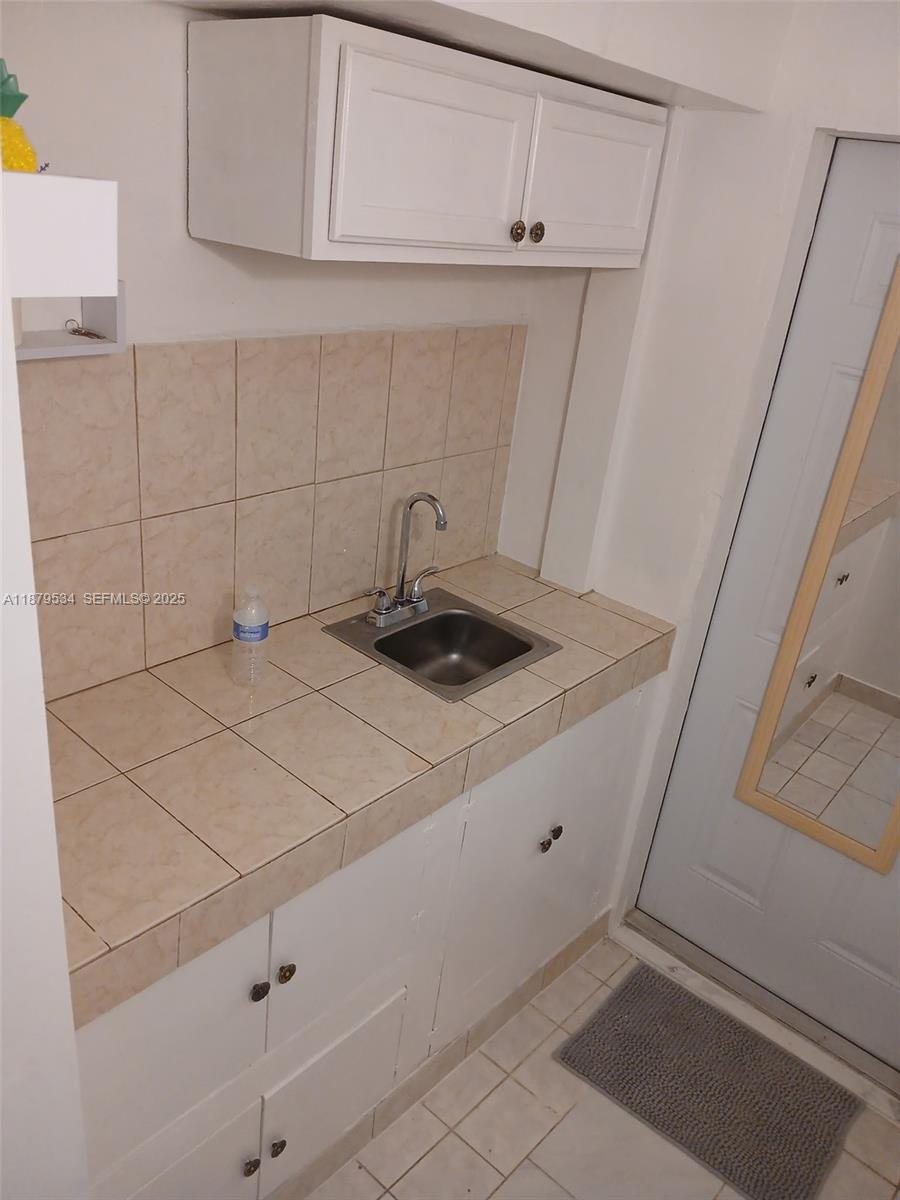 11510 Southwest 182nd Terrace, Unit 2 Miami, FL 33157 - Photo 5 of 7 a kitchen with a sink and cabinets