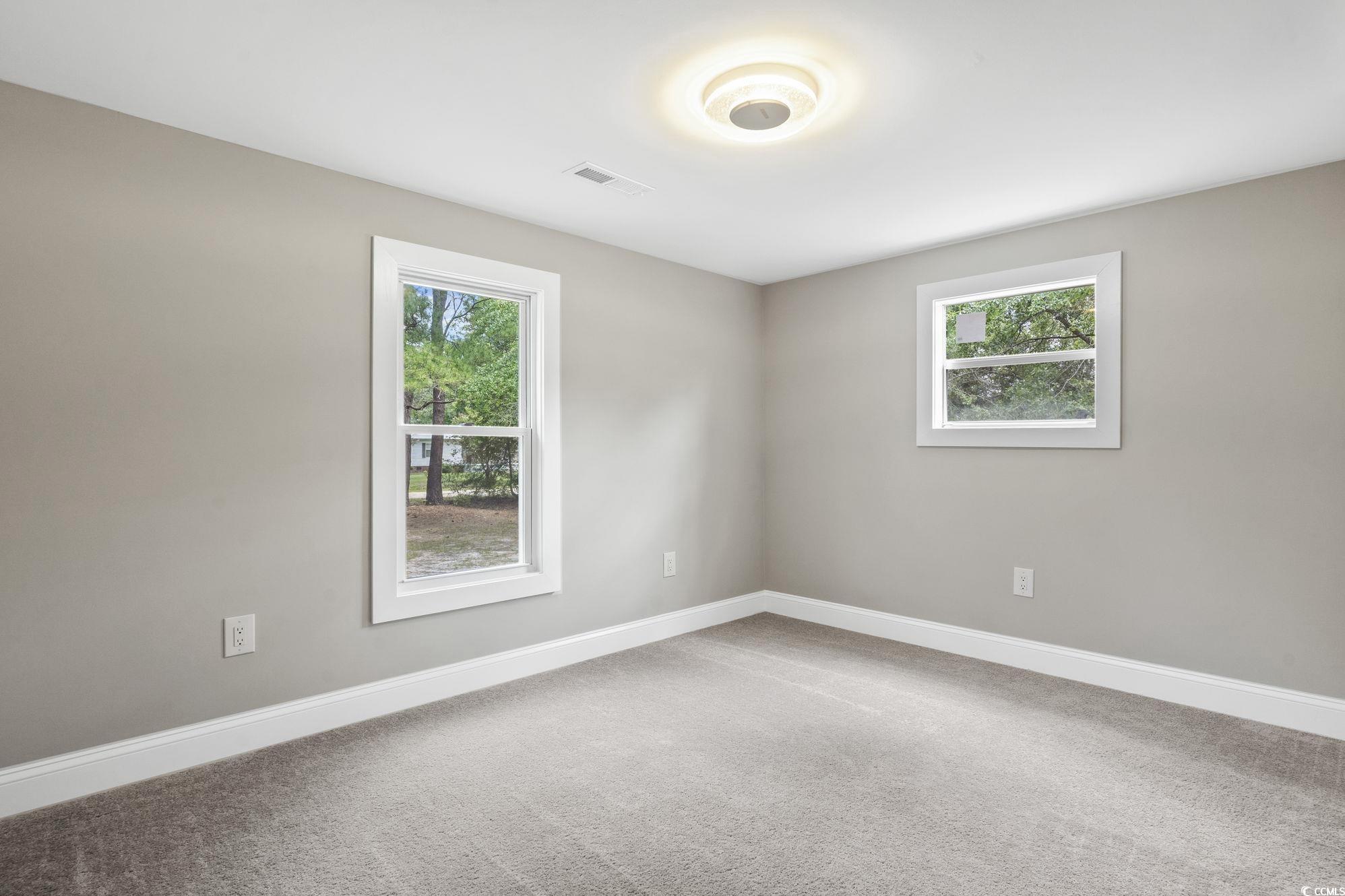 2074 Jem Lane Conway, SC 29527 - Photo 14 of 15 Carpeted empty room featuring healthy amount of natural light