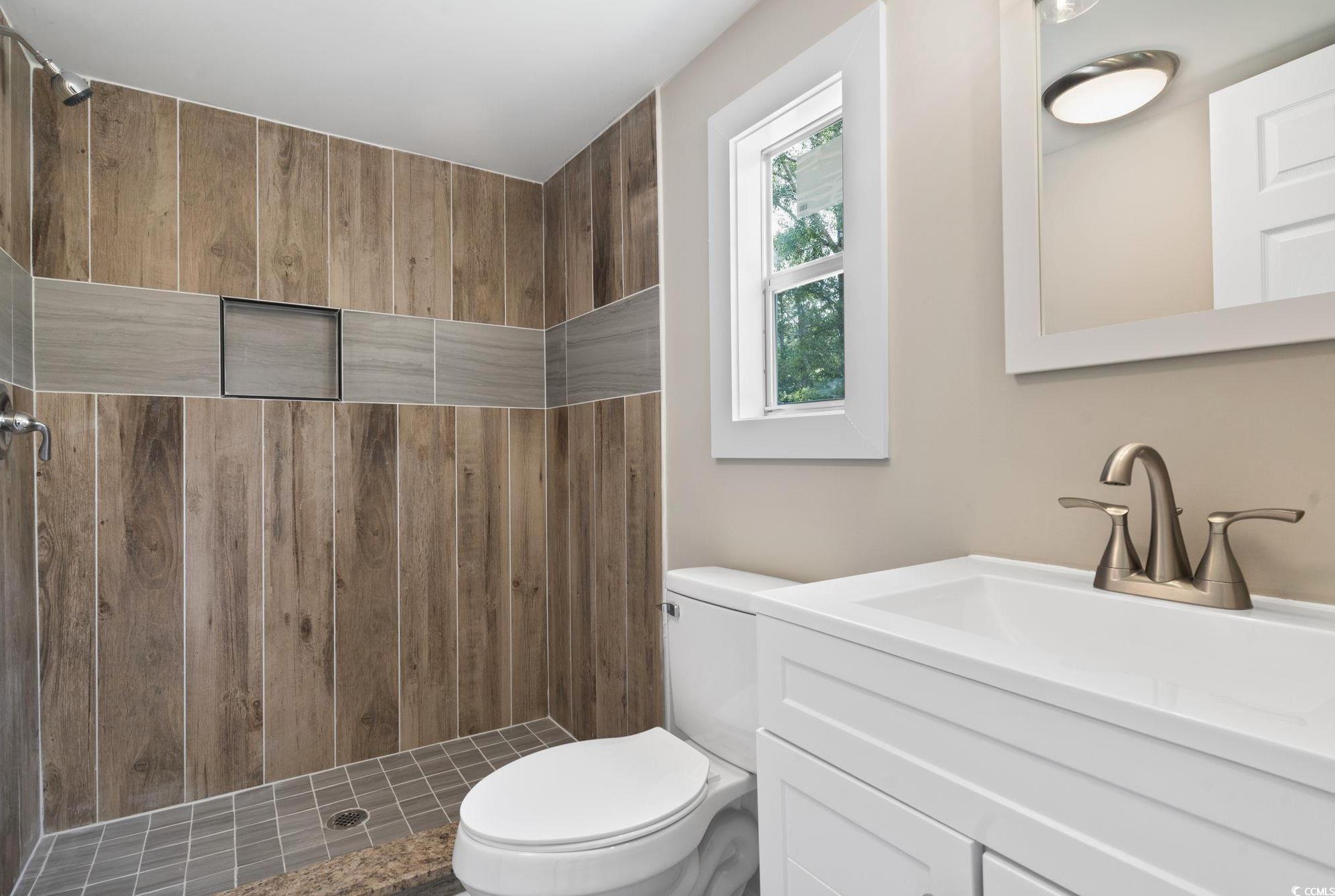 2074 Jem Lane Conway, SC 29527 - Photo 8 of 15 Full bathroom with vanity and a tile shower