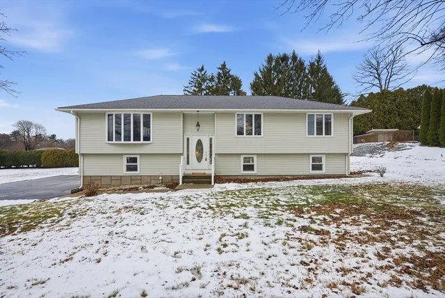 a house with trees in the background