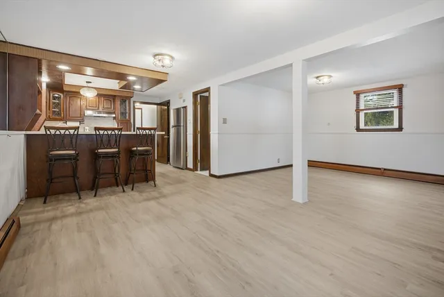 a view of a livingroom with furniture and chandelier