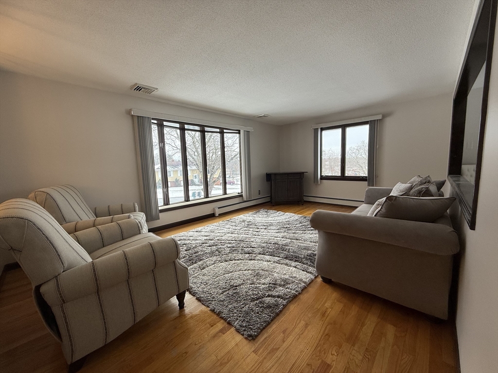 63 Helene Street Ludlow, MA 01056 - Photo 5 of 11 a living room with furniture and a window