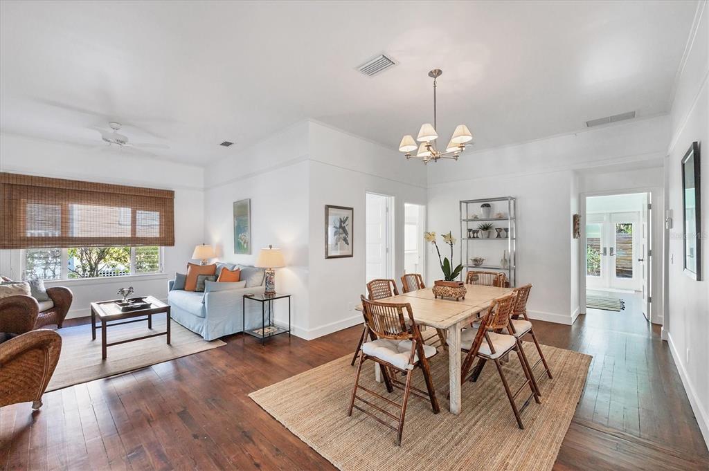 380 Tarpon Avenue Boca Grande, FL 33921 - Photo 15 of 38 a view of a dining room with furniture window and wooden floor