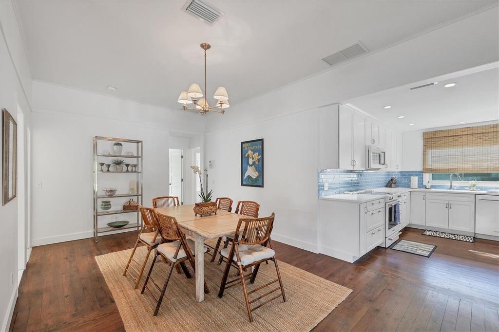 380 Tarpon Avenue Boca Grande, FL 33921 - Photo 16 of 38 a view of a dining room with furniture and wooden floor