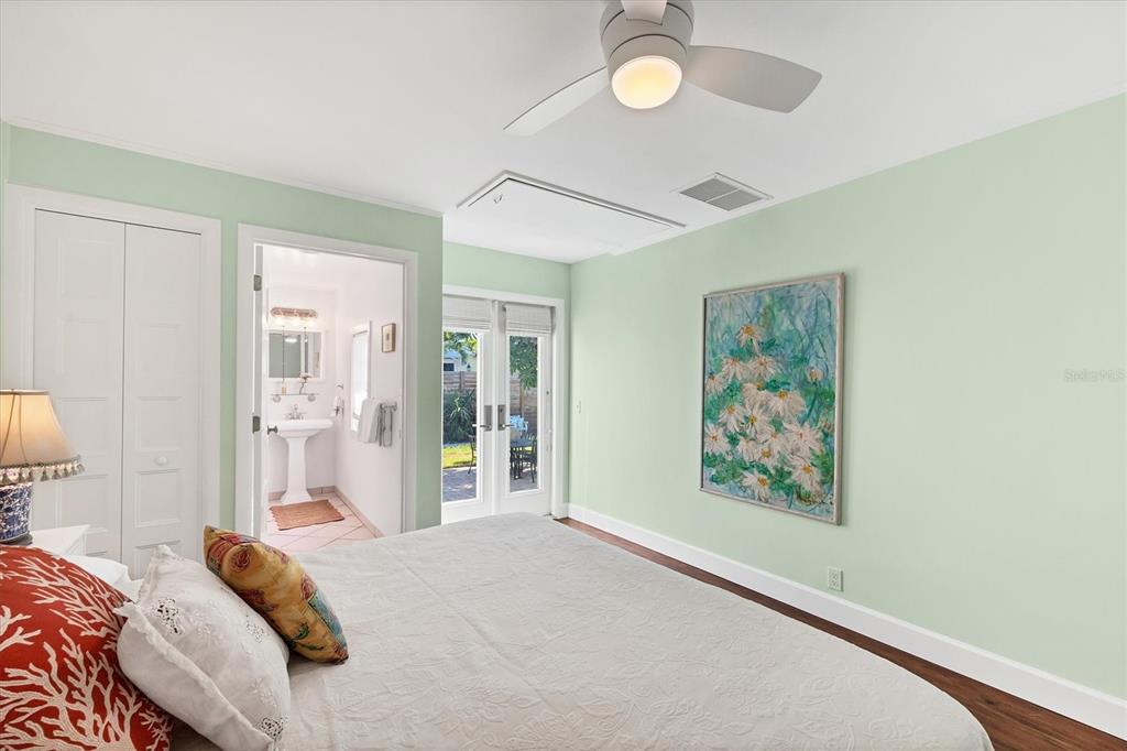 380 Tarpon Avenue Boca Grande, FL 33921 - Photo 20 of 38 a bedroom with a bed and a painting on the wall