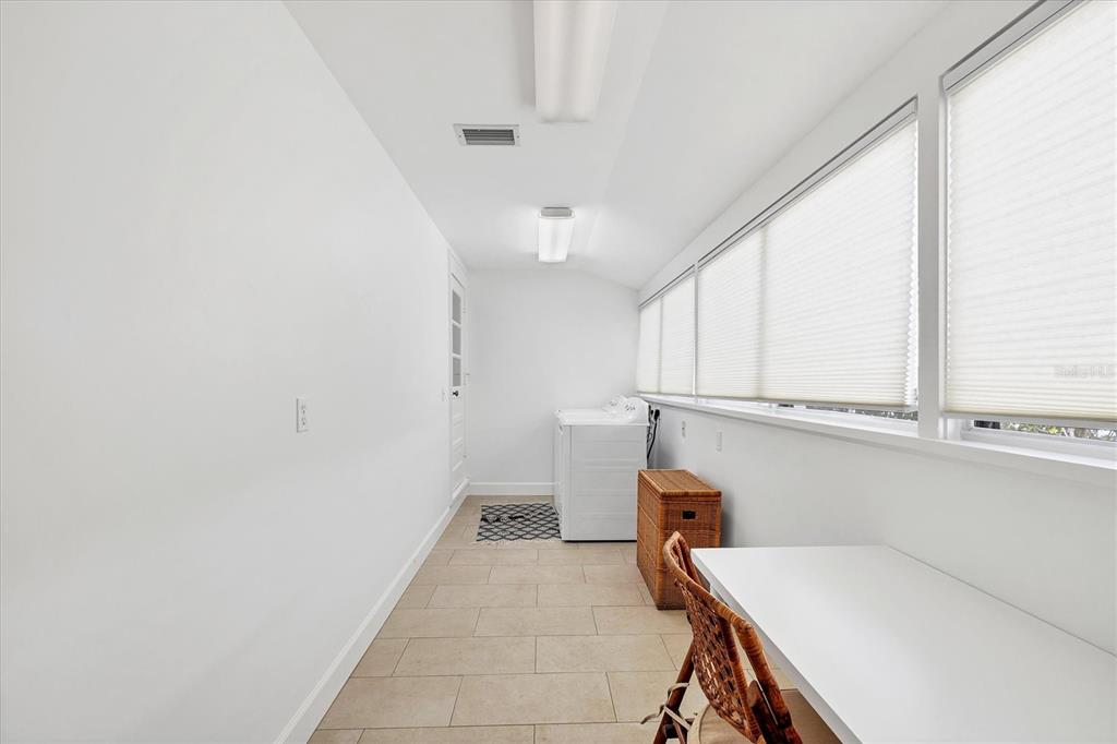 380 Tarpon Avenue Boca Grande, FL 33921 - Photo 27 of 38 a room with storage and utility