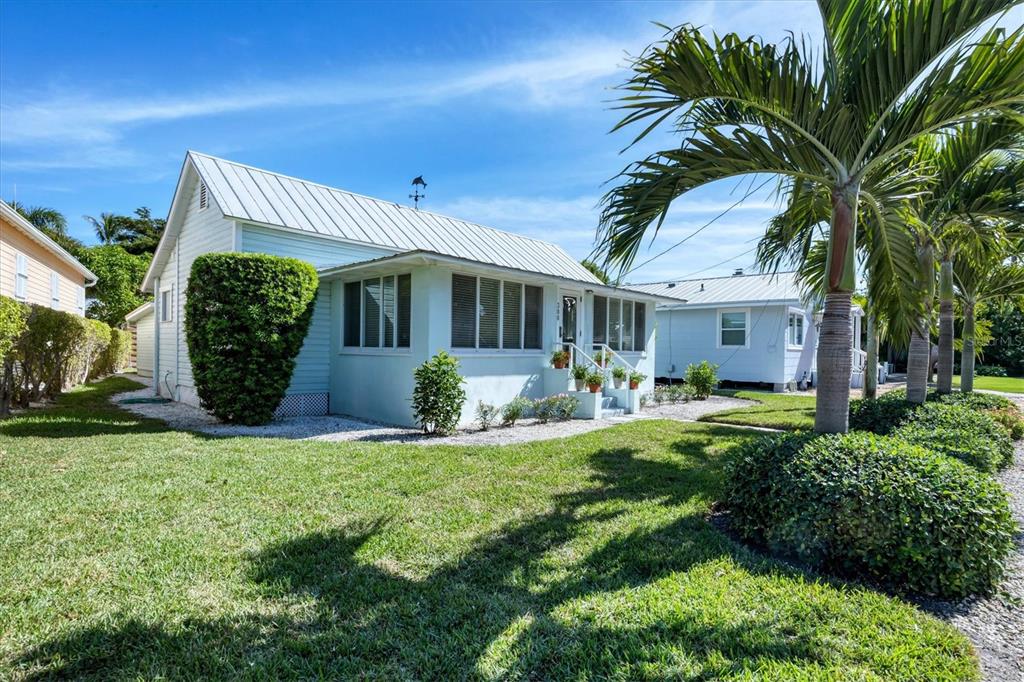 380 Tarpon Avenue Boca Grande, FL 33921 - Photo 3 of 38 a view of a house with backyard and sitting area