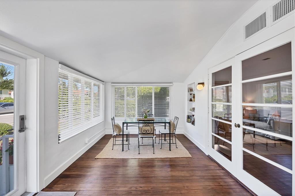 380 Tarpon Avenue Boca Grande, FL 33921 - Photo 6 of 38 a dining room with furniture large windows and wooden floor