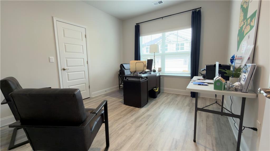 620 Bald Ridge Circle Demorest, GA 30535 - Photo 23 of 43 a living room with furniture and wooden floor
