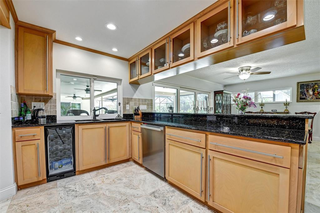 1875 Belleair Road Clearwater, FL 33764 - Photo 15 of 100 a kitchen with stainless steel appliances granite countertop a stove a sink and a microwave