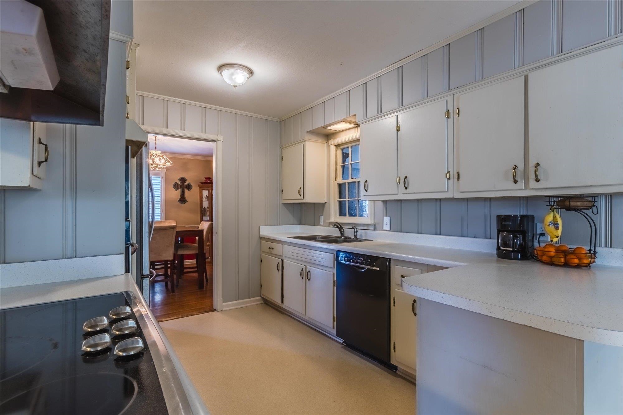 1490 Hayne Road Memphis, TN 38119 - Photo 13 of 33 a kitchen with stainless steel appliances granite countertop a sink stove and refrigerator