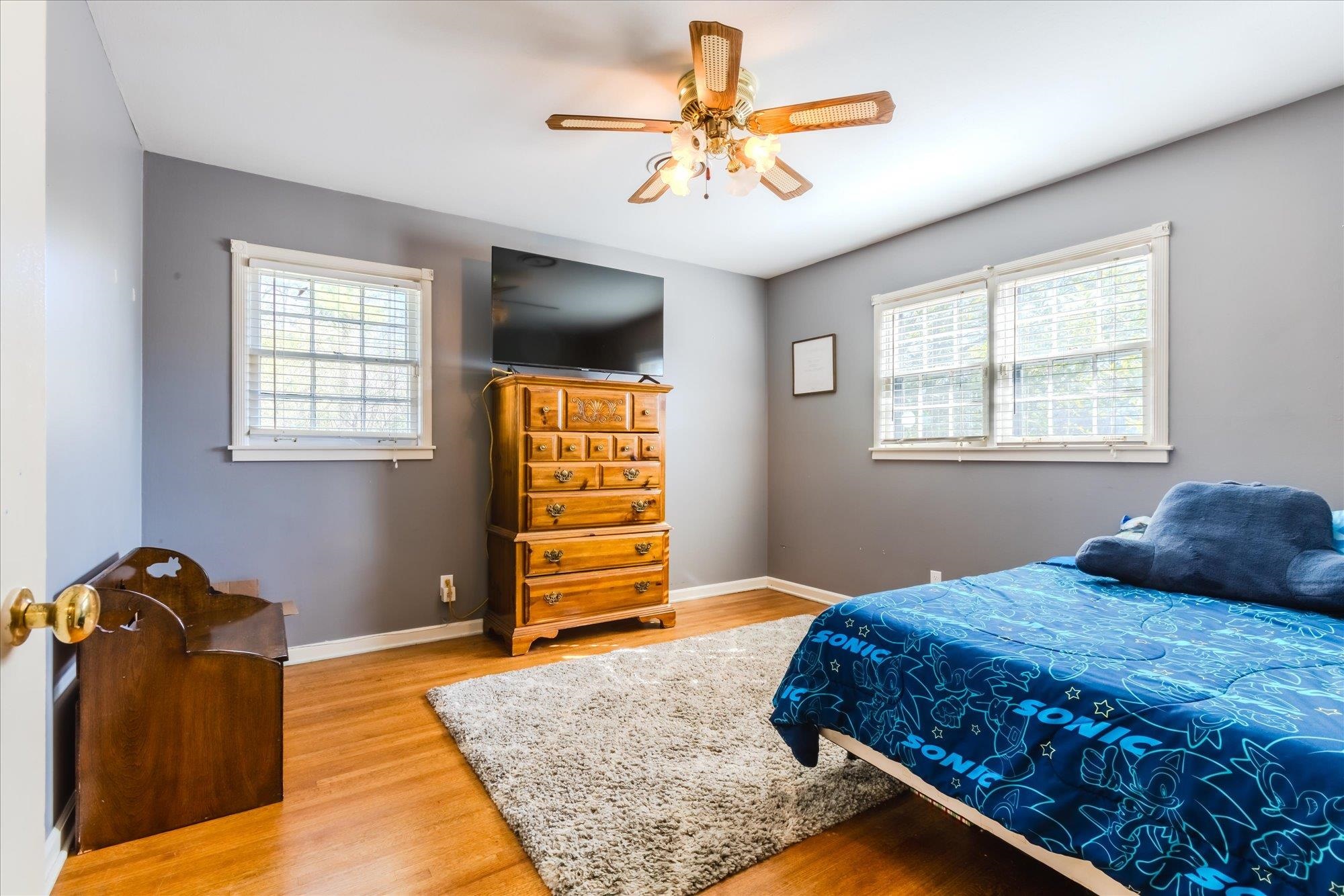 1490 Hayne Road Memphis, TN 38119 - Photo 23 of 33 a bedroom with a bed and dresser with mirror