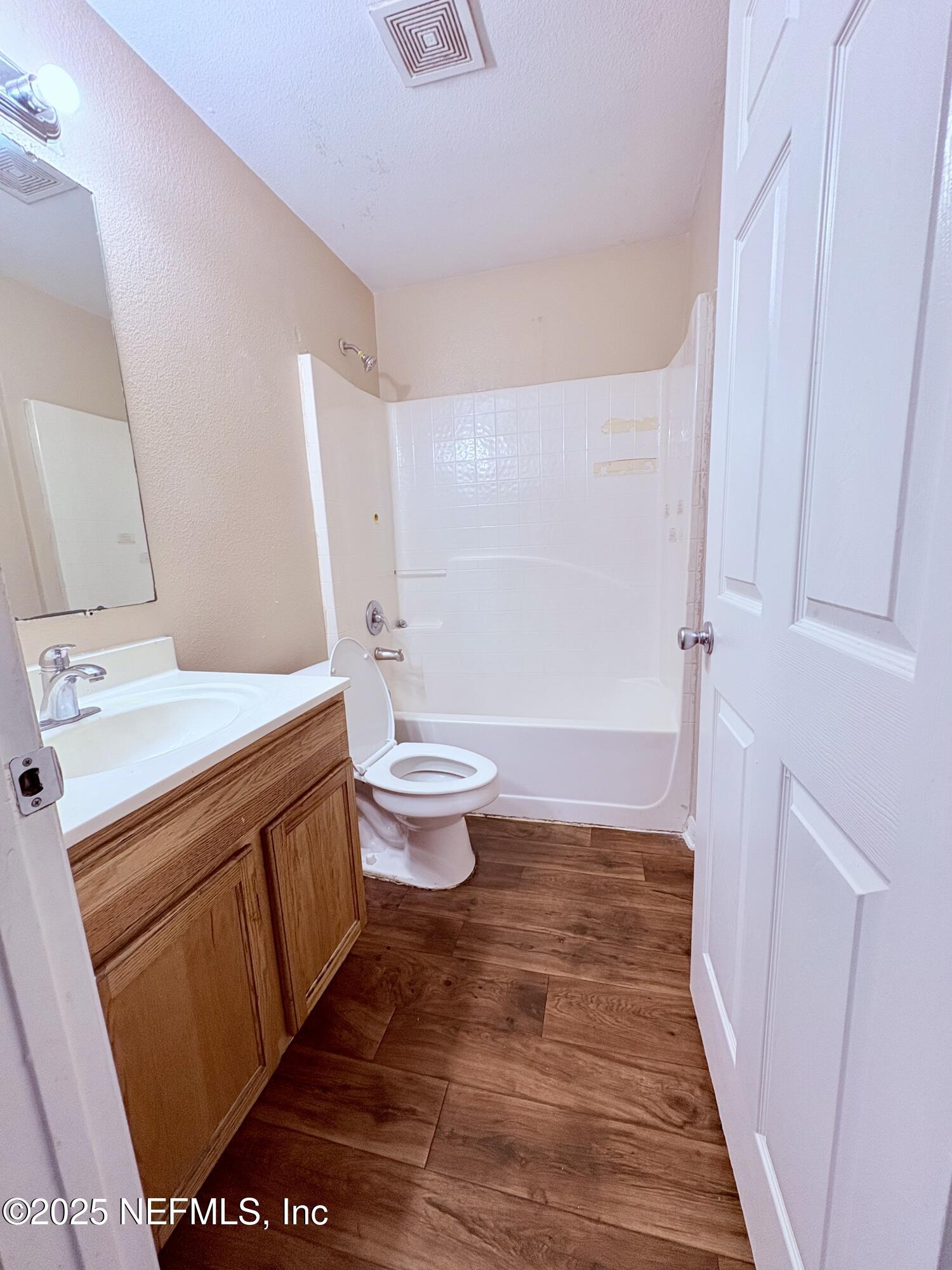 2996 Valkyrie Road Middleburg, FL 32068 - Photo 8 of 9 a bathroom with a sink a toilet and a shower