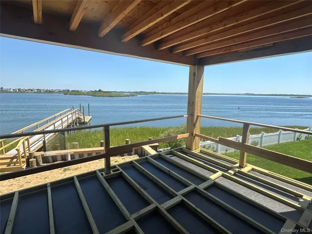 a view of a patio with wooden floor