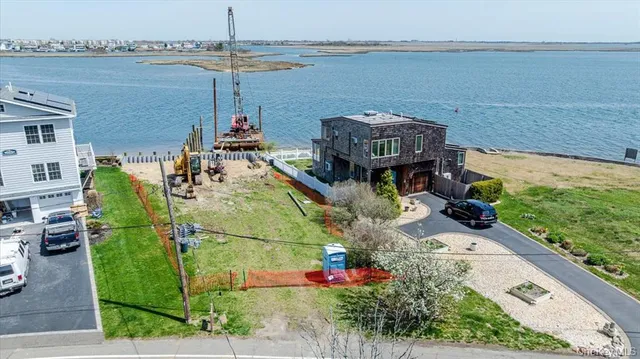 a terrace with outdoor seating and city view