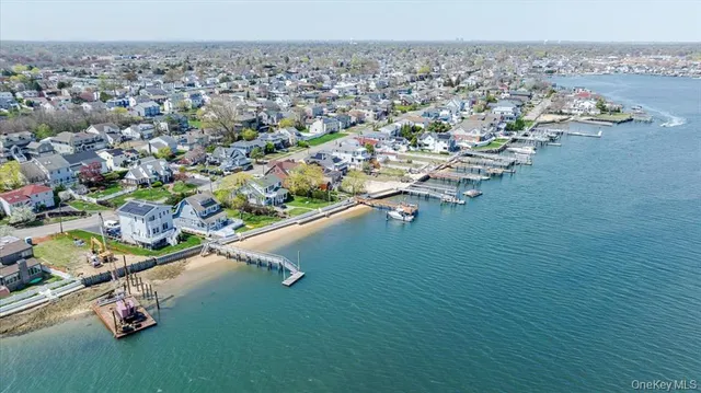 an aerial view of a house with a ocean view