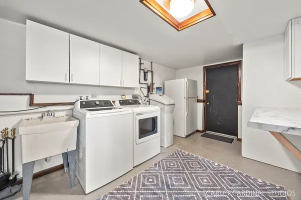 a view of a kitchen with a stove top oven