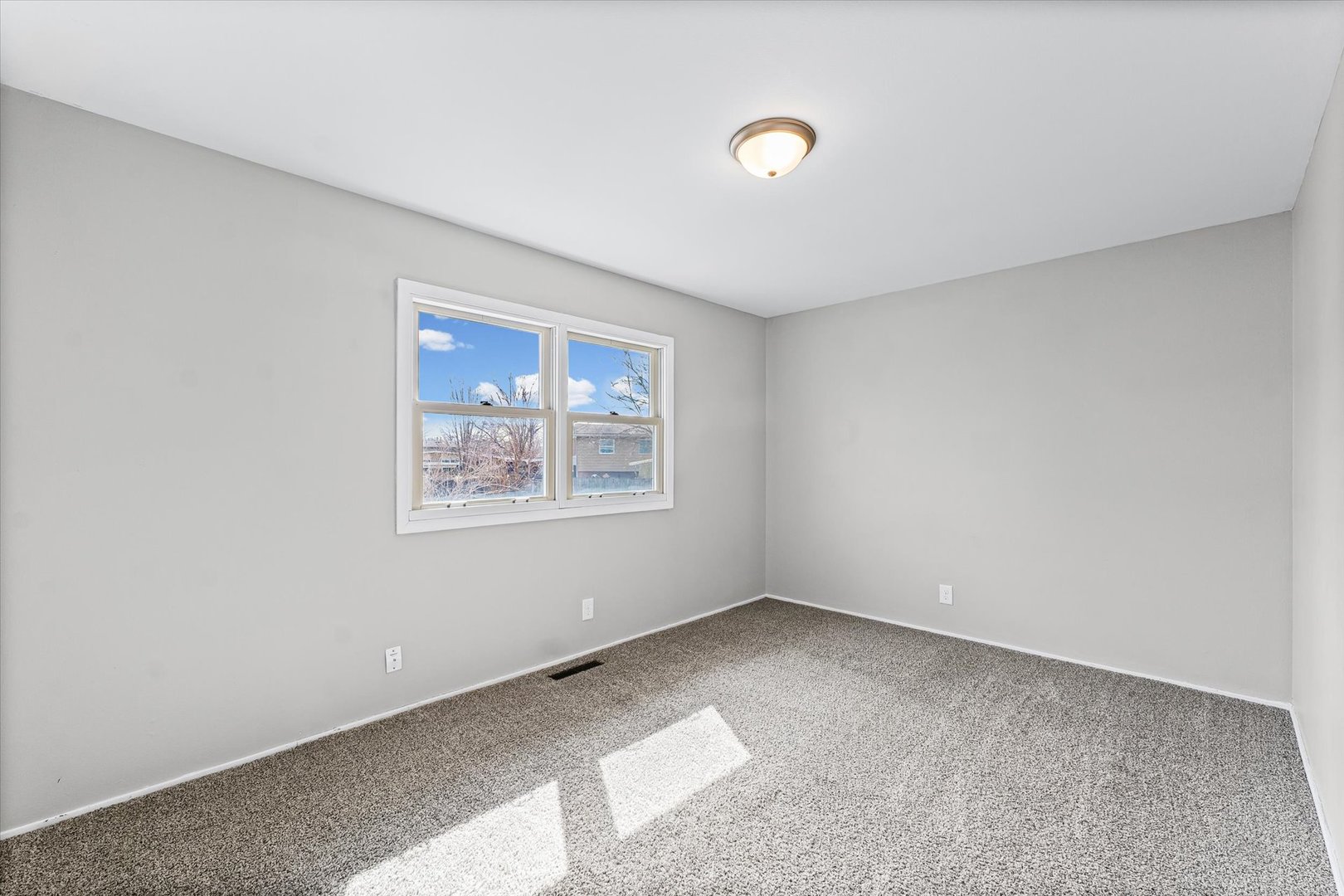 1612 Golfview Road Rantoul, IL 61866 - Photo 16 of 28 an empty room with windows