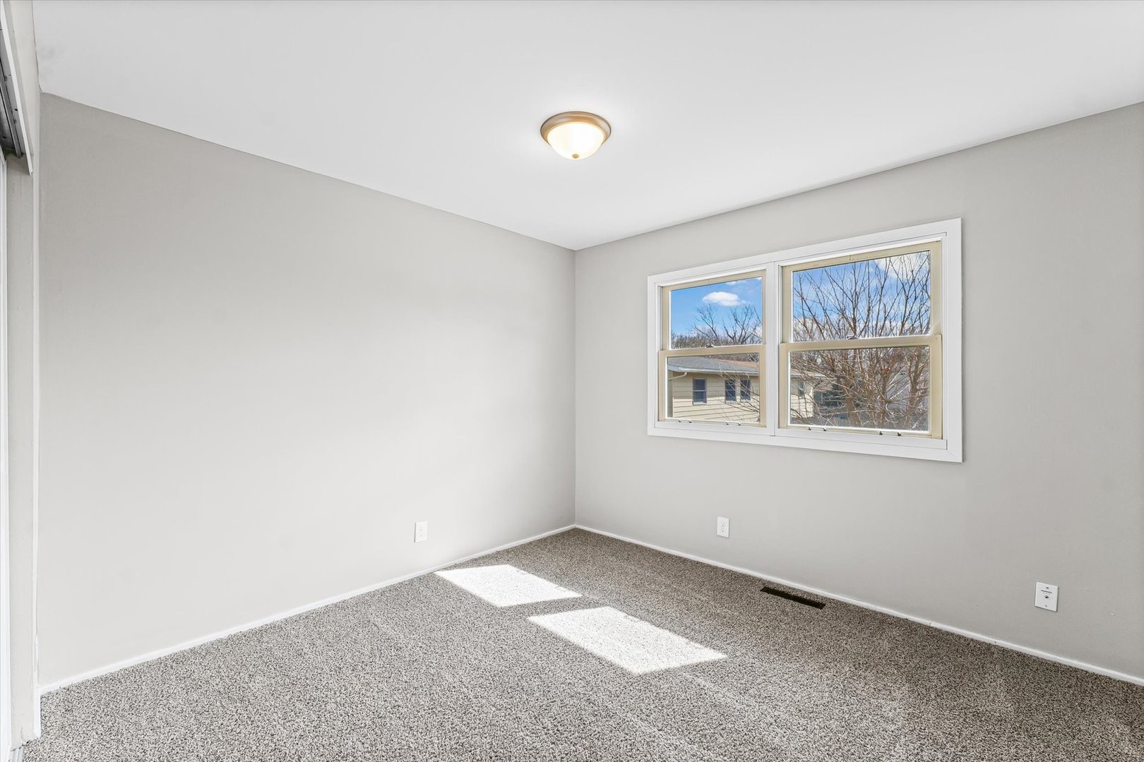 1612 Golfview Road Rantoul, IL 61866 - Photo 18 of 28 a view of an empty room with a window