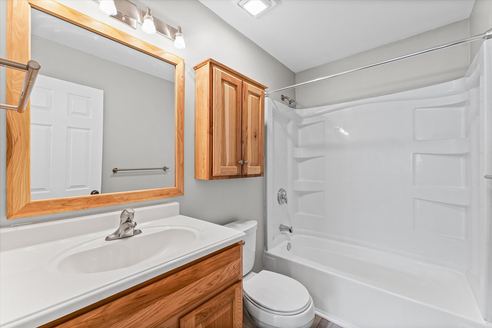 1612 Golfview Road Rantoul, IL 61866 - Photo 20 of 28 a bathroom with a granite countertop sink toilet and shower