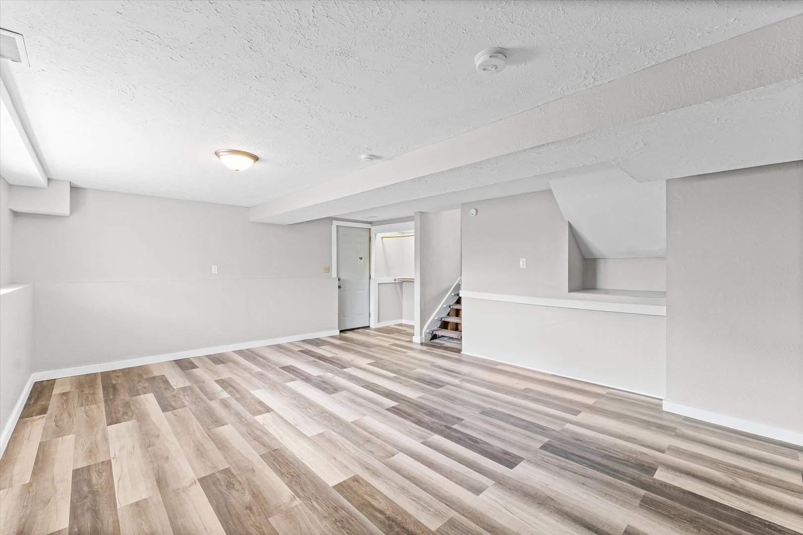 1612 Golfview Road Rantoul, IL 61866 - Photo 22 of 28 a view of a bedroom with a bed and wooden floor